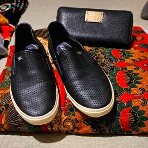 Michael Kors perforated-style sneaker in Black w/ white rubber trim, Preloved